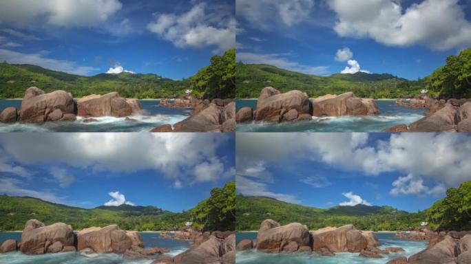 热带岛屿上的云、山丘和岩石海滩