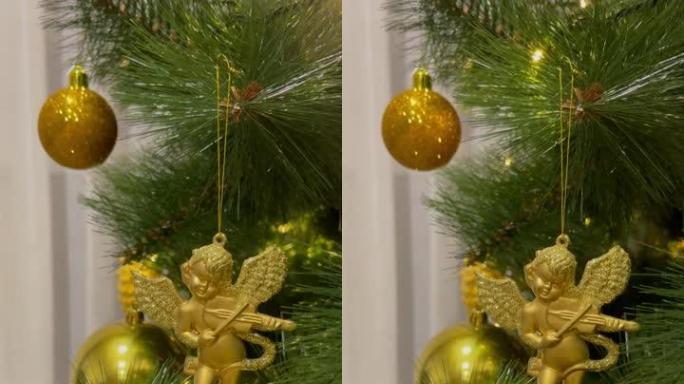 黄花环挂在圣诞树上的金色天使
