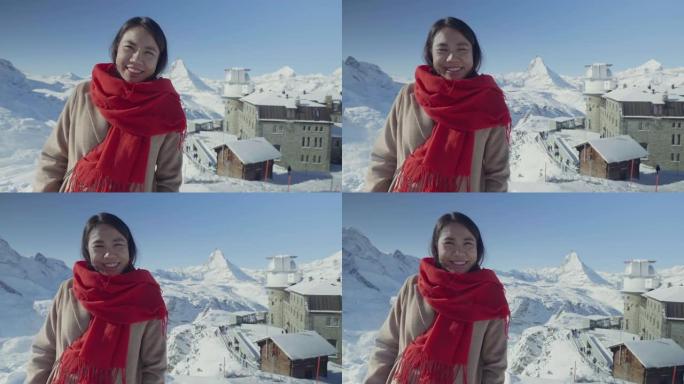 女人拍照欣赏马特宏峰和瑞士阿尔卑斯山的景色