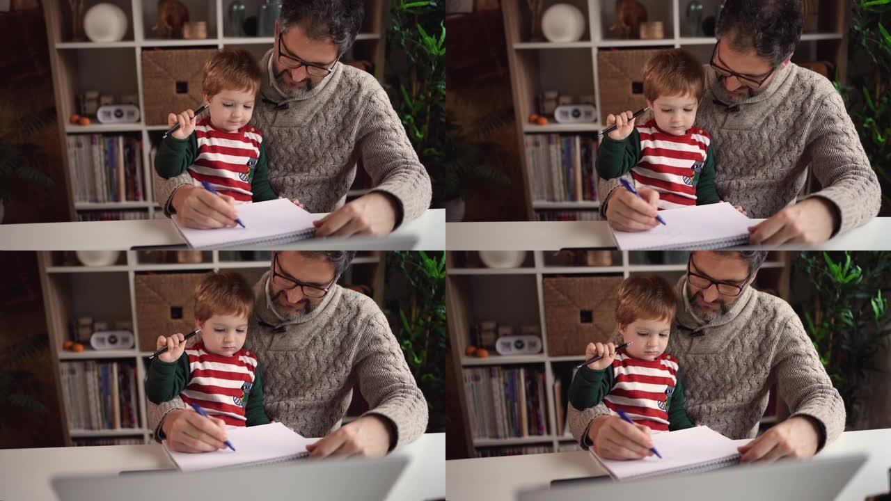 父亲和儿子一起在纸上画画