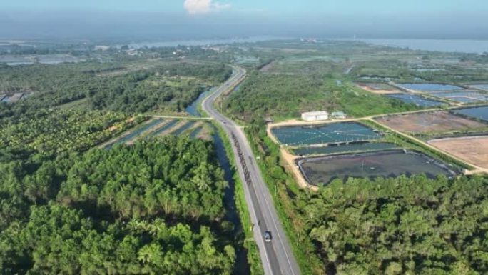 在泰国宋卡府乡村某处的道路上骑自行车的空中射击组