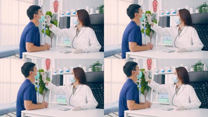 亚洲专业专家医生诊断PCR冠状病毒样本。在医学实验室医院，年轻女医生使用快速抗原检测为患者做快速拭子