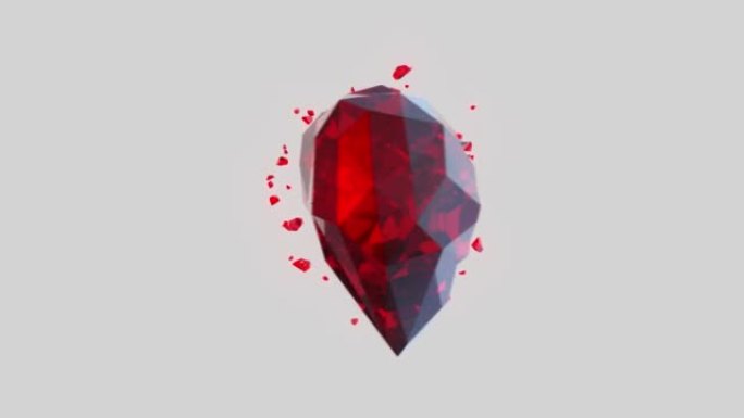 浅灰色背景上的破碎红宝石水晶心