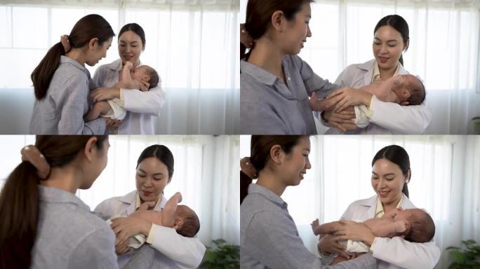4k，亚洲妇女抱着一个刚出生的婴儿2个月大的亚洲生病的女医生在医院监督和检查身体