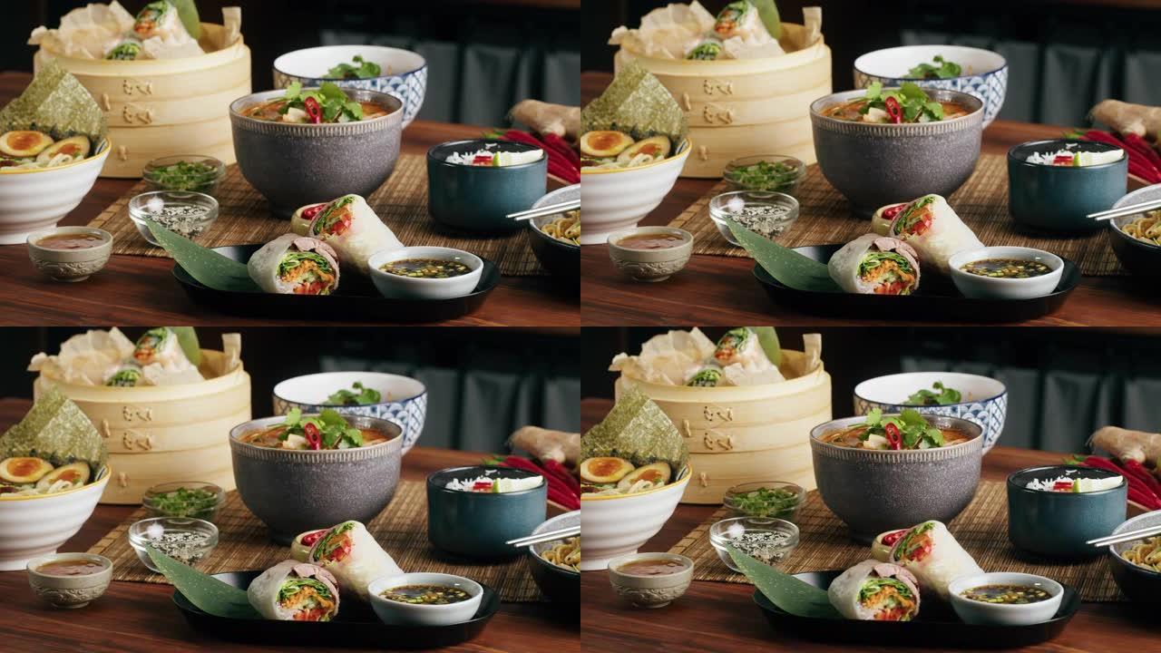 日本拉面配牛肉或鸡肉，米粉配炒肉，汤山药功夫辣泰国亚洲汤，厨师用韩国传统中餐烹饪。美味的越南菜特写。