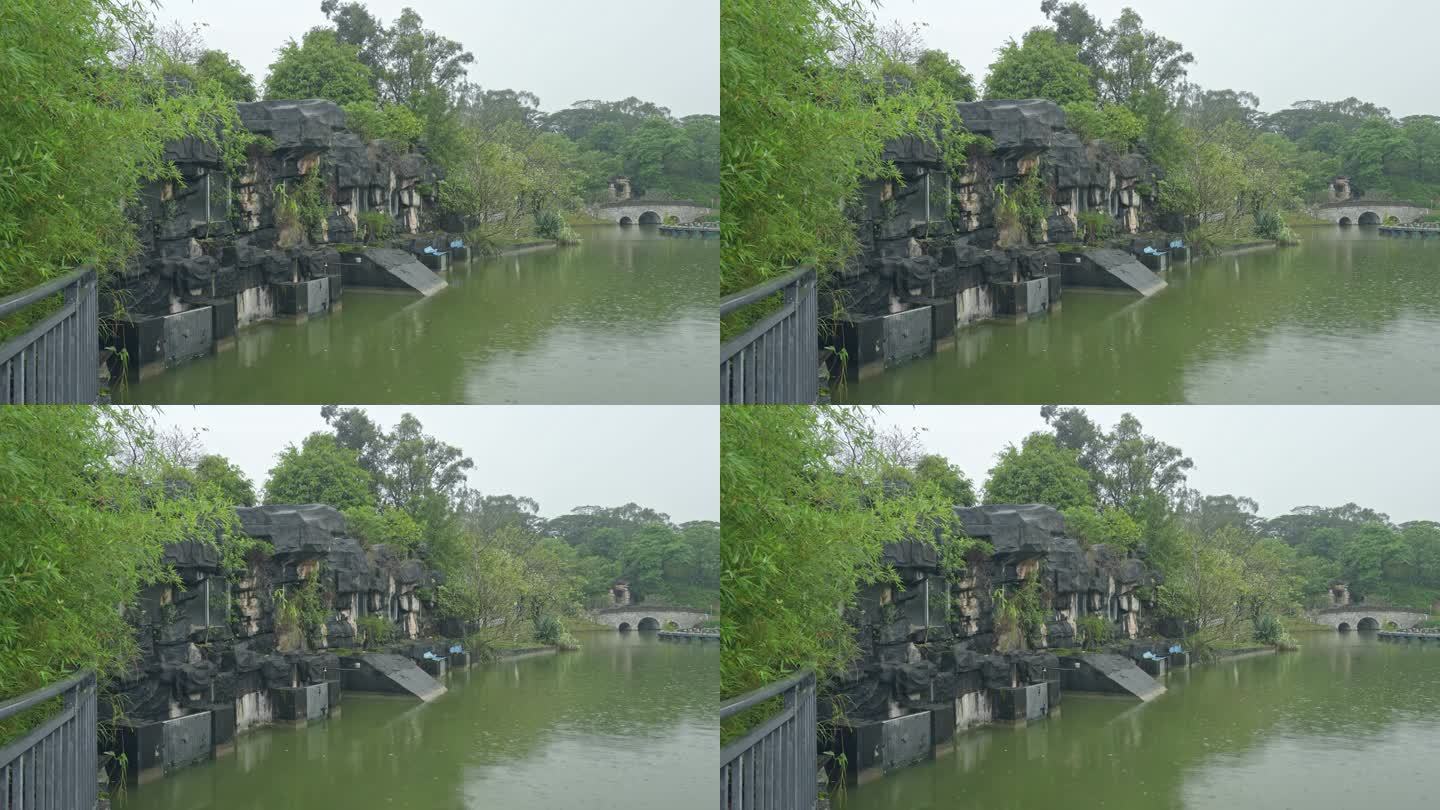 4K实拍，春雨中广州公园湖边的拱桥与假山
