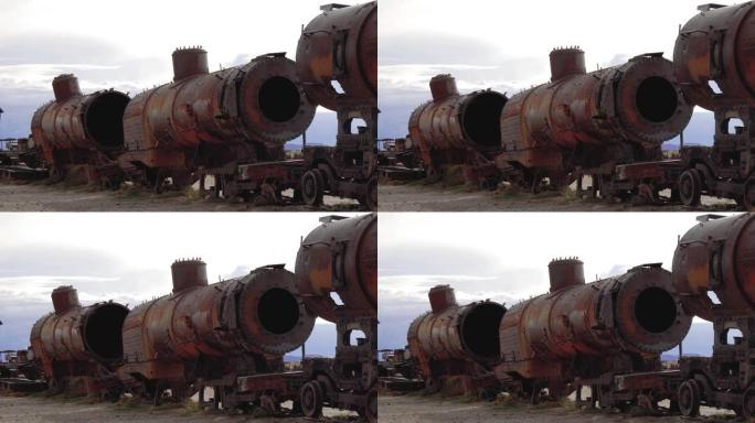 废旧金属垃圾场上的一辆生锈的废弃火车的坦克