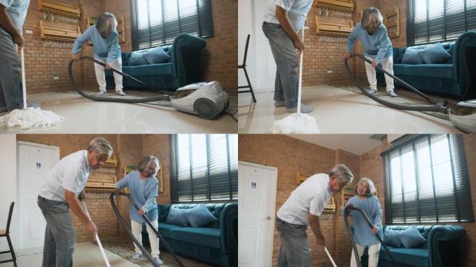 老年人健康生活理念。使用吸尘器的老年妇女。老人用拖把打扫房子