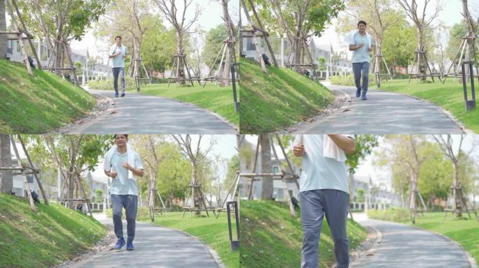 老人在公园慢跑。成熟的亚洲男子在户外运动。快乐运动亚洲成熟男子跑步者慢跑锻炼后快乐地锻炼。