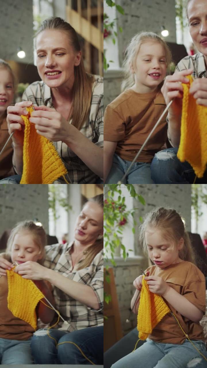 母女俩从事针线活。女人给女孩织针，帮助编织