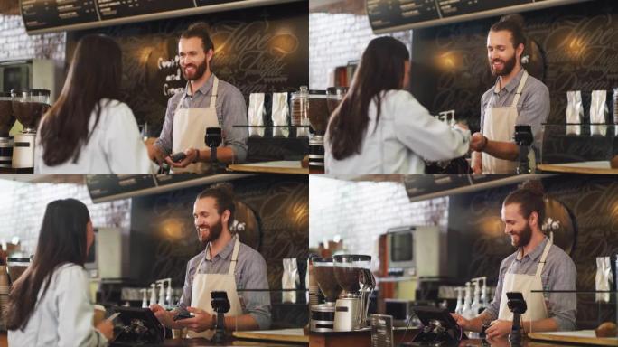 4k视频片段，一位顾客在咖啡馆里为她的咖啡付款