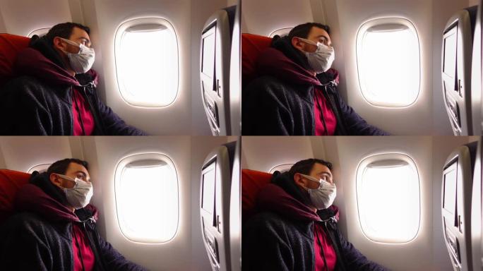 坐在飞机沙龙里戴着面膜的男人在叹气，透过窗户看