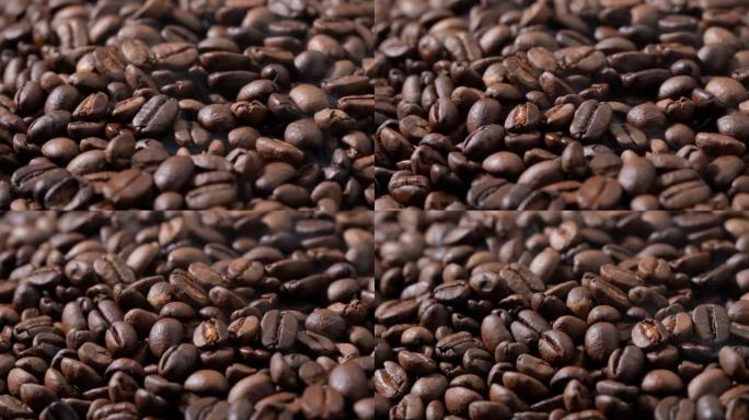 旋转堆烤咖啡豆。一大堆新鲜烘焙的浓郁芳香咖啡豆。慢动作。