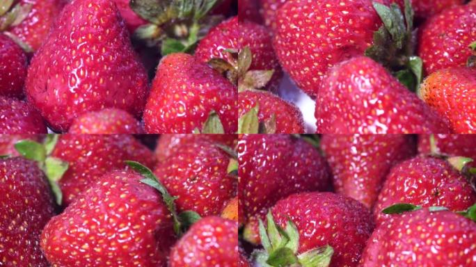 美丽栽培深红色草莓草莓大团旋转特写。