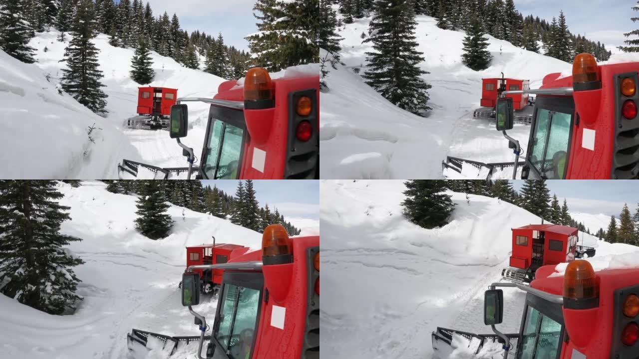 扫雪机救援拖拉机在暴风雨过后在山上快速行驶，慢动作