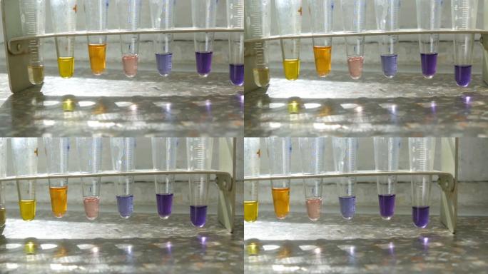 医用试管在实验室里用彩色液态水在实验室里用试剂在窗户上用大理石窗台。