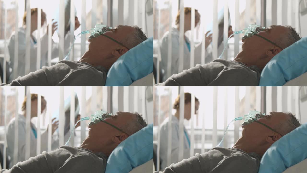 医院带氧气面罩卧床老人的侧视图