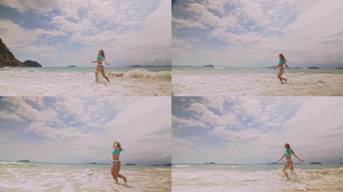 女人在海上奔跑。一个醉醺醺的女人正在热带岛屿上享受她的假期。女孩有趣摆姿势。概念暑假