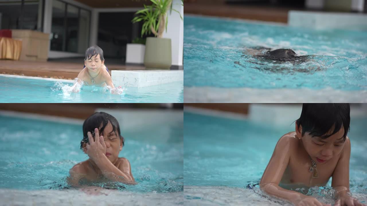 夏天，年轻的亚洲男孩在游泳池里享受和玩水的慢动作镜头