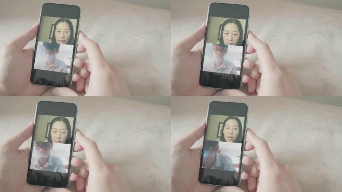 女人使用数字平板电脑和手机与家人进行社交电话会议