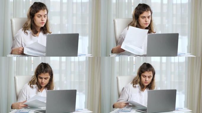 残疾女性自由职业者在家里的桌子上用笔记本电脑工作