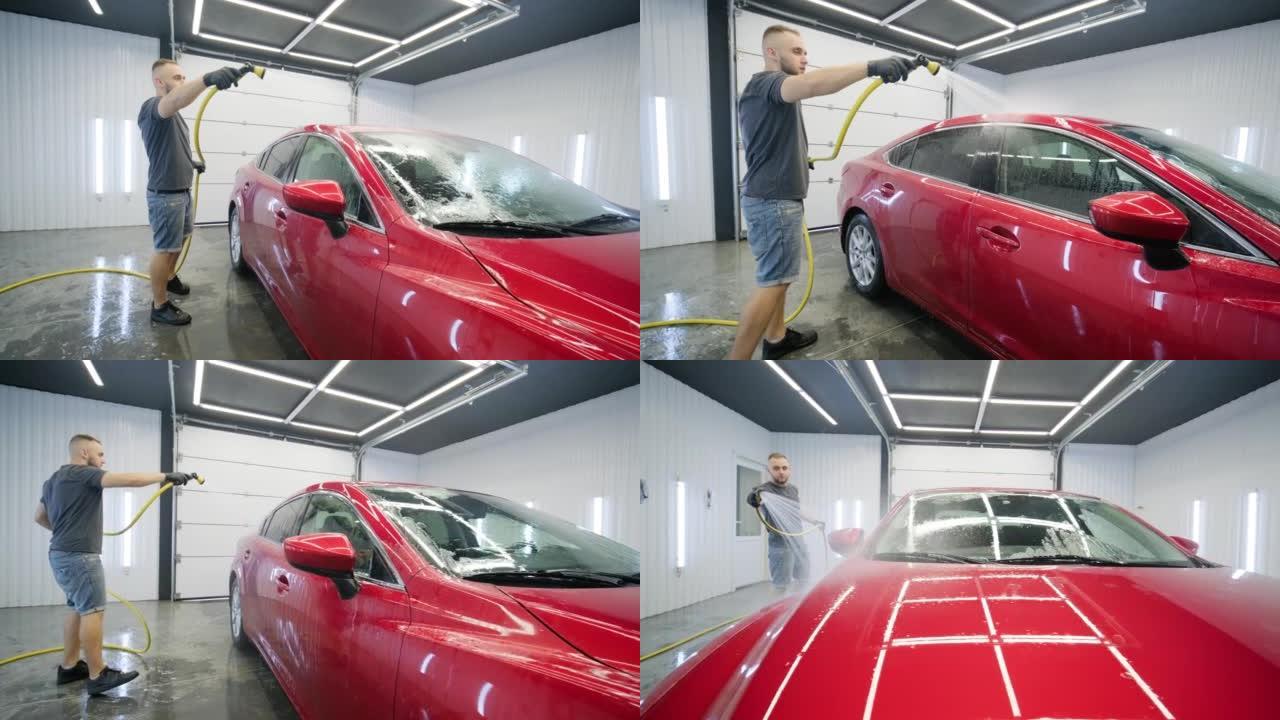 用泡沫和高压水清洗洗车。红色汽车