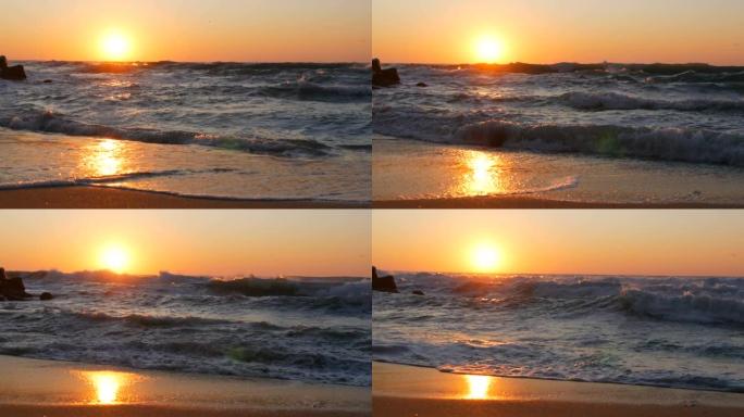 海边的日出或非常美丽的日落。沙滩和在沙滩上拍打的海浪。泡沫大风暴波