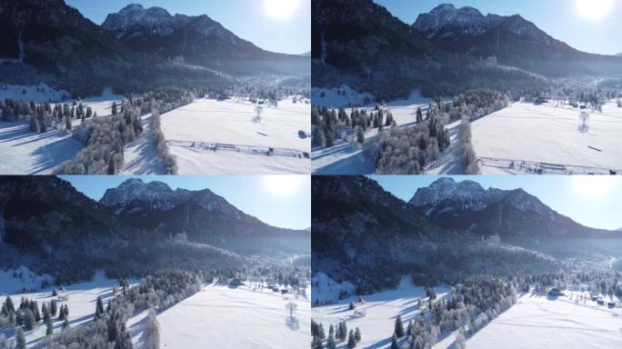 从无人机上看到冬季山脉全景中的新天鹅堡。