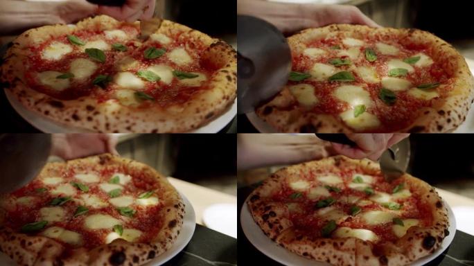 用圆刀切披萨。特写美味披萨玛格丽塔。