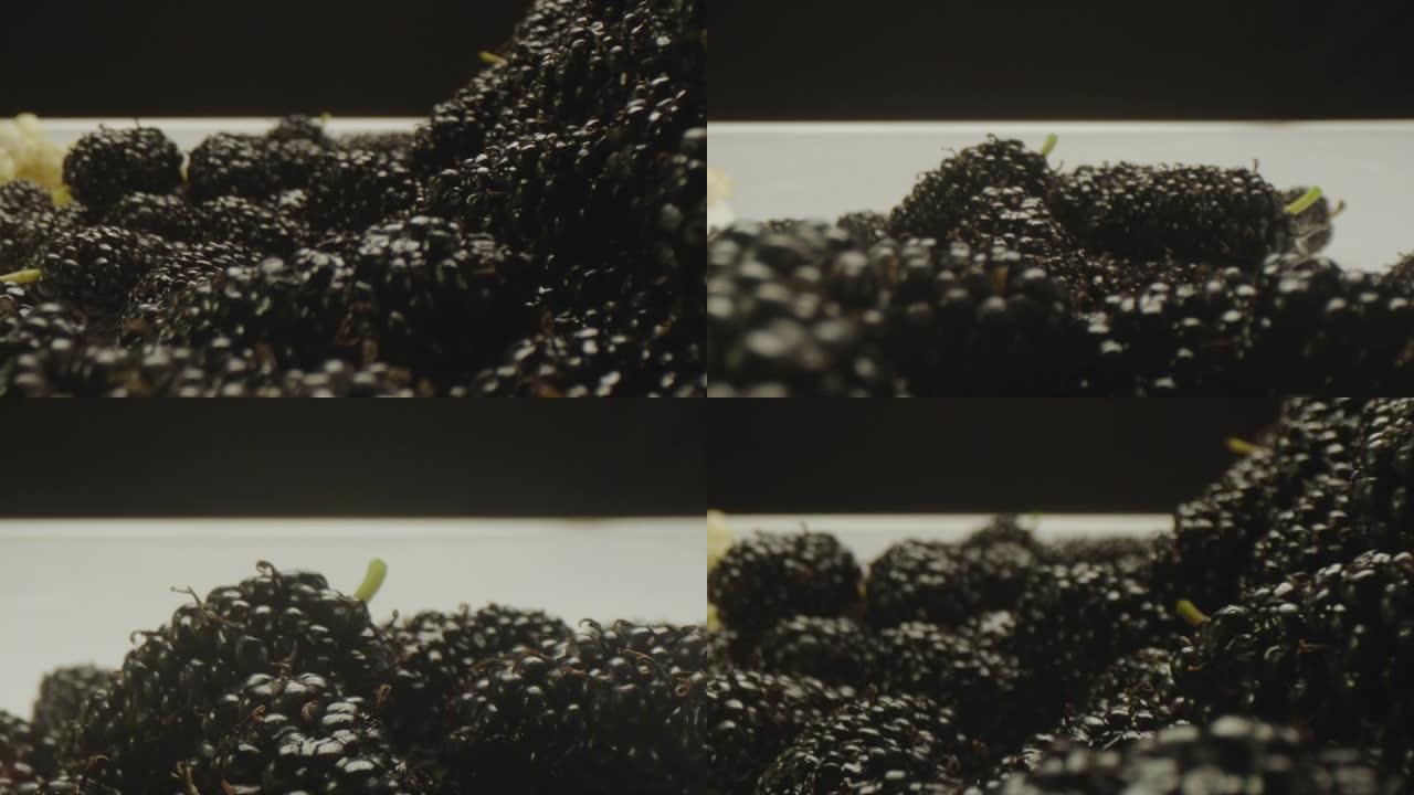一组新鲜，有机，黑色和白色的桑葚水果在桌子上。近距离观察不同种类的桑葚。在ARRI ALEXA电影摄