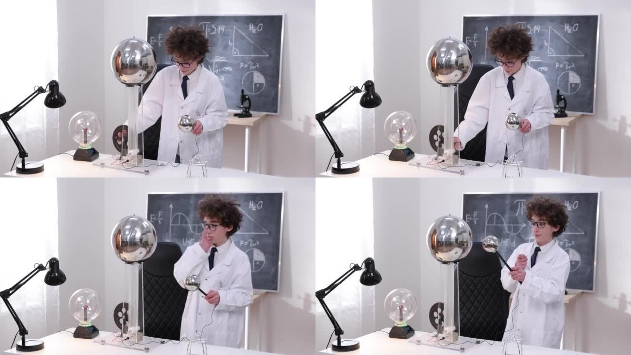 教育，科学和儿童概念-男孩在物理实验室中戴着护目镜进行电气测试。在实验室研究放电的孩子