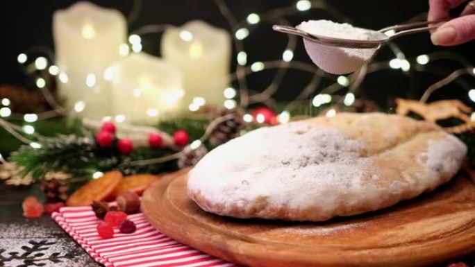 传统的圣诞蛋糕，带杏仁饼和乡村背景的干果
