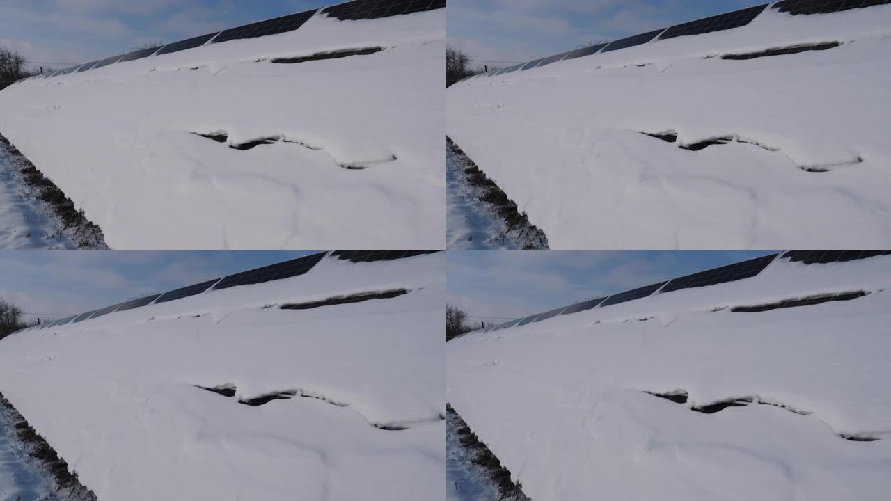 发电厂太阳能电池板上的雪。大幅减少发电量