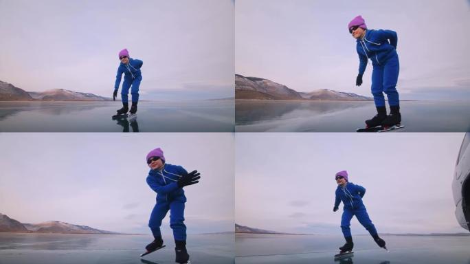 女孩在冰上速滑训练。孩子在冬天穿着蓝色运动服和运动眼镜滑冰。儿童速滑运动