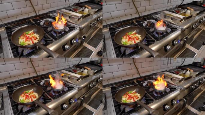 在铸铁锅中煮熟的蔬菜和不断上升的火焰