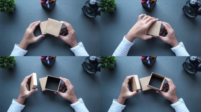 人的俯视图打开一个空的小礼品盒