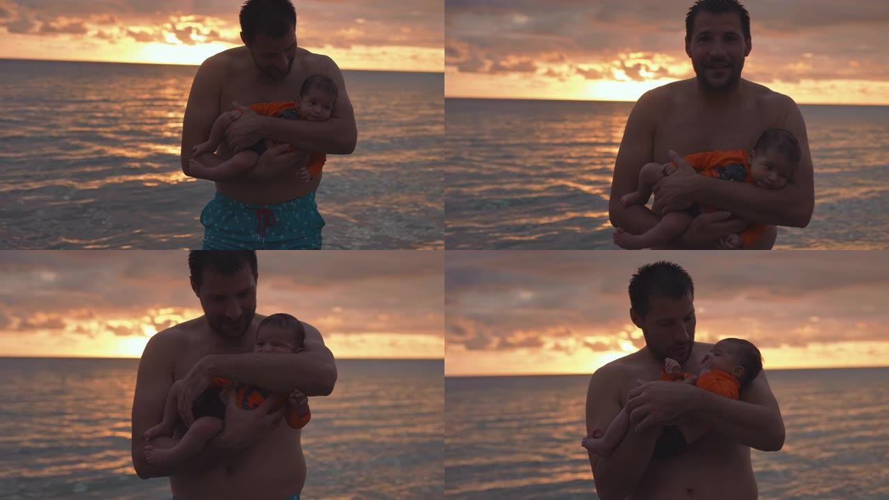 慈爱的父亲在海滩上抱着婴儿的儿子