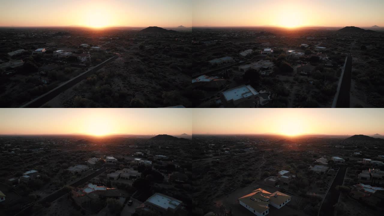 亚利桑那州凤凰城郊外农村住宅的发光橙色日落天线