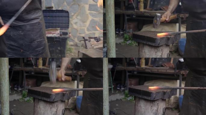 铁匠锻造铁匠铁砧锤人手动锻造熔融金属。