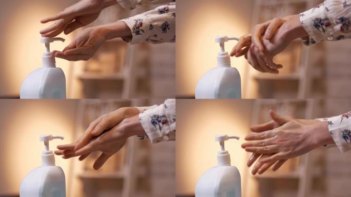 女人的手和洗手液的特写。