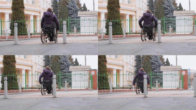 残疾人坐在轮椅上沿着街道移动，边境阻止轮椅移动