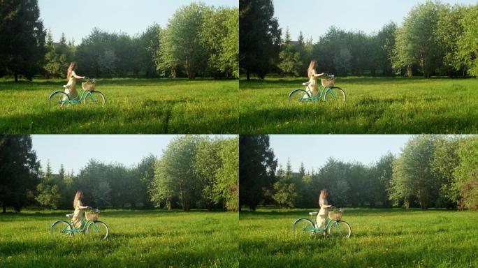 夏季，骑自行车的女人在乡村道路上骑自行车。穿着衣服的美女骑自行车的人在地面小径上骑自行车，绿色的草地