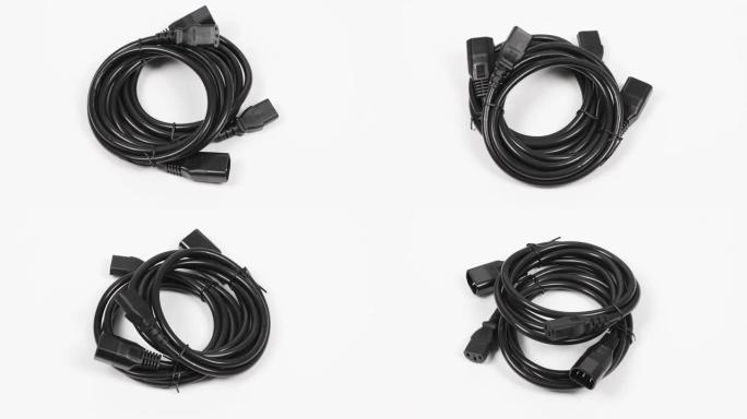 两个黑色电源线C13-C14连接器，白色。侧视图。循环运动。