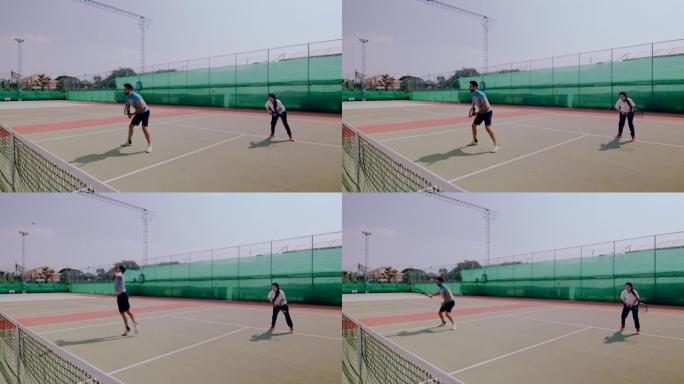 业余网球双打凌空抽射的慢动作动态镜头。