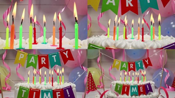 在气球和丝带背景上的蛋糕上燃烧蜡烛。