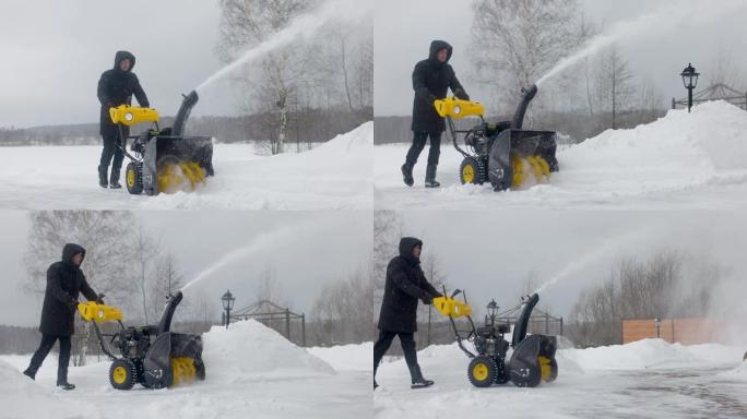 男子在庭院用机械扫雪机除雪。慢动作