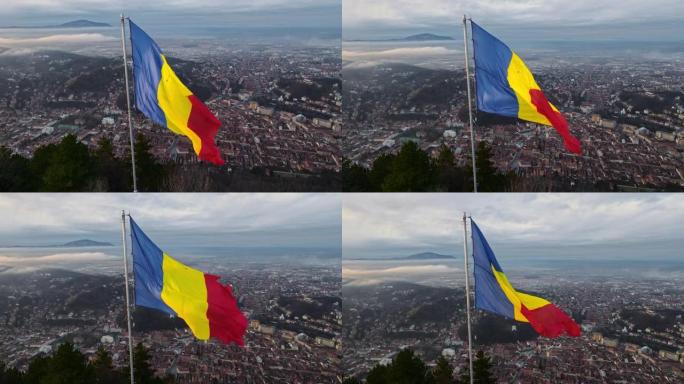 国旗在Barsov附近的山顶上，裸露的树木，低云，城市景观，罗马尼亚