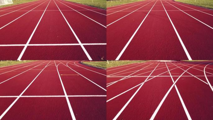 在跑道上跑步的跑步者的无人机视图和第一人称视图