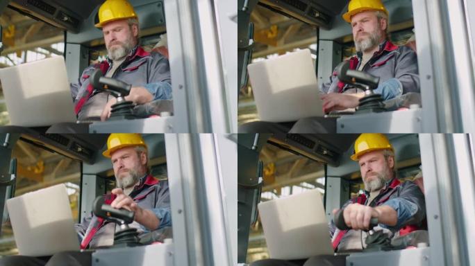 高级工厂技术员用笔记本电脑检查建筑机械