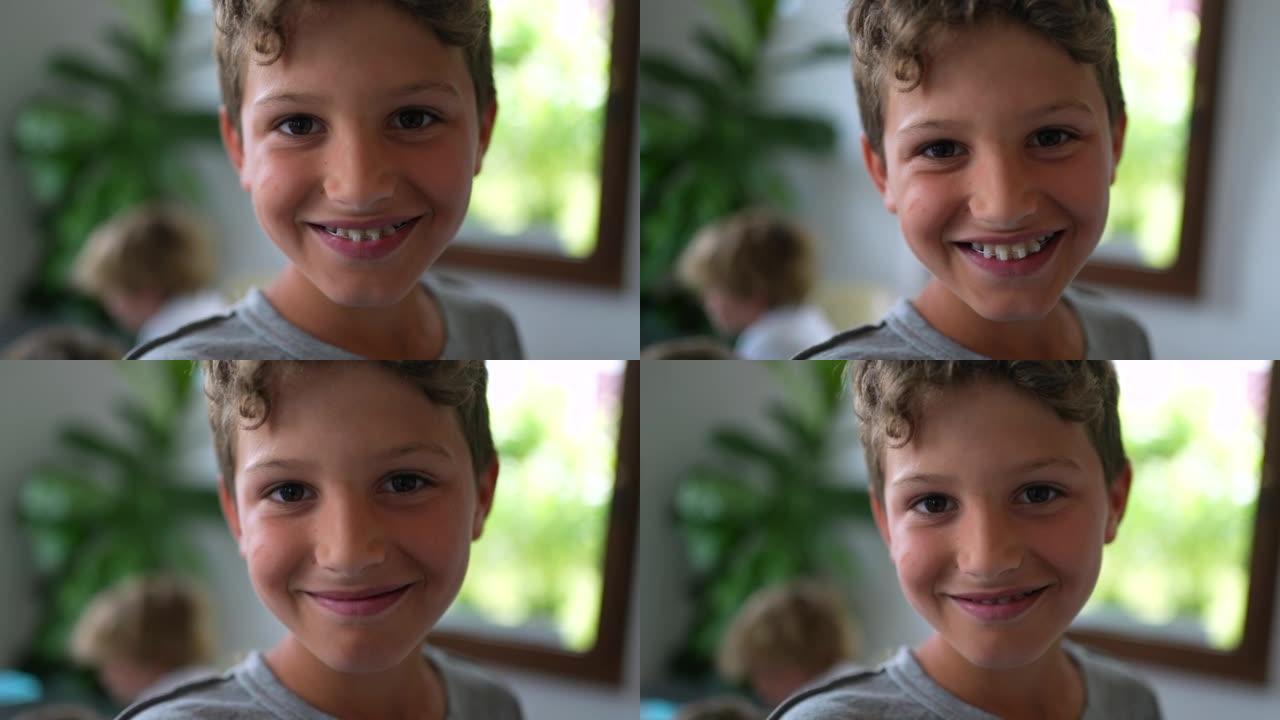 小男孩在镜头前微笑的肖像孩子的脸特写镜头